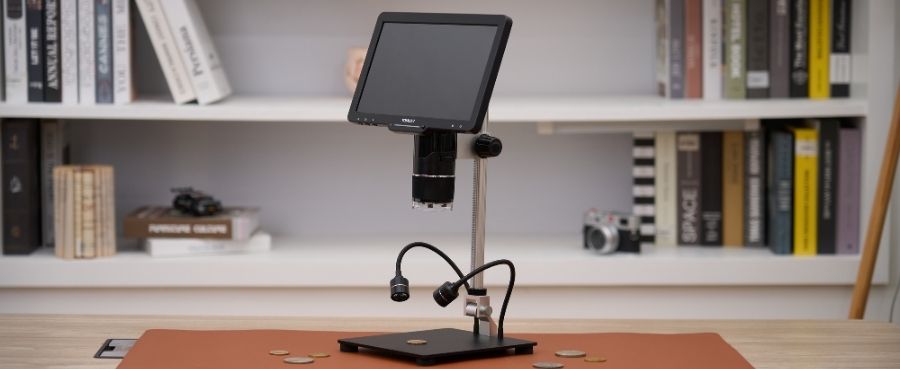 TOMLOV TRIL110 10.1" 3 Lens 2K HDMI Digital Microscope set up on a desk with dual gooseneck lights.