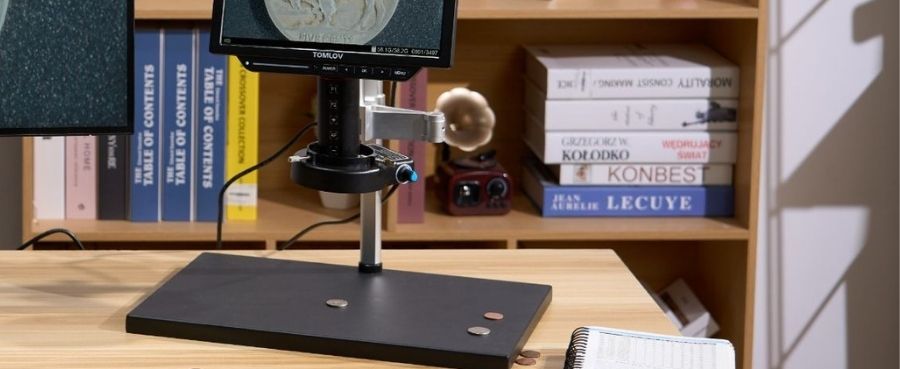 Tomlov DM9 7" LCD Digital Microscope set up on a desk for coin examination.